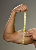 Man-measuring-flexed-arm-muscles.jpg